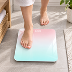 Person stepping onto a slim digital bathroom scale