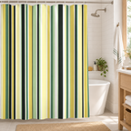 Green and yellow striped shower curtain in a guest bathroom