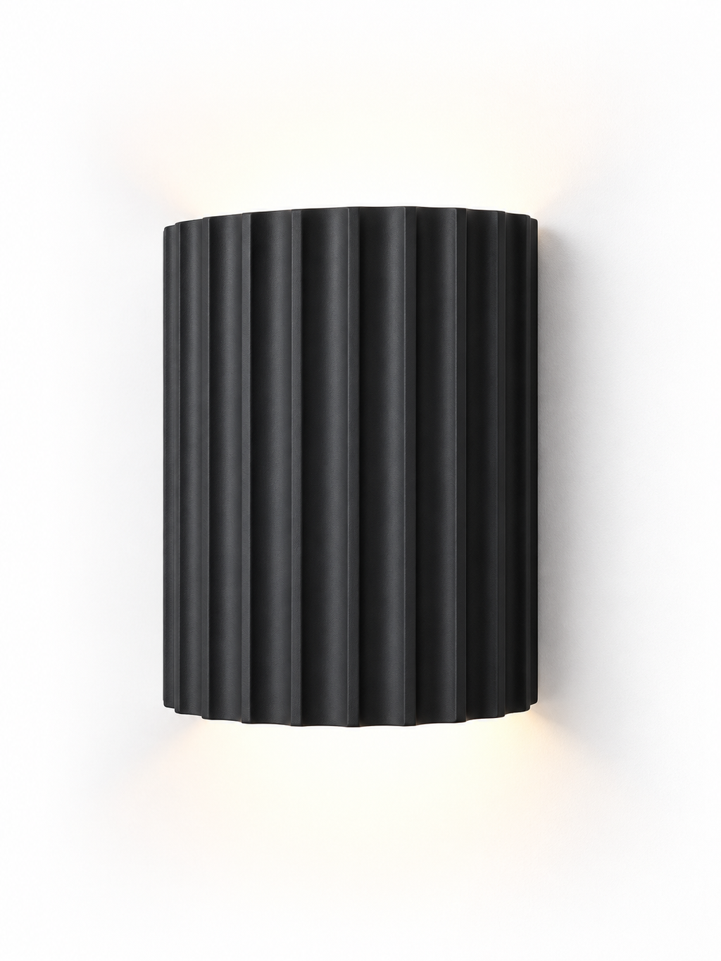 Black fluted resin wall sconce on white background