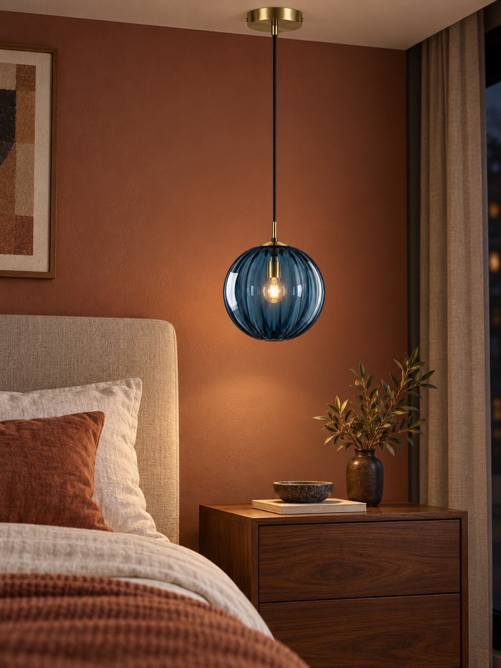 Blue ribbed glass pendant light beside a boutique bedroom