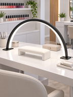 Crescent arch LED lamp over a manicure workstation