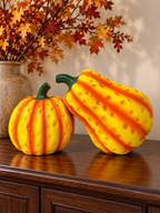 Dimpled yellow-orange pumpkin sculpture set in an autumn buffet display
