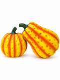 Two dimpled yellow-orange pumpkin sculptures on a white background