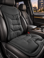 Black ergonomic car seat cushion in a premium vehicle interior