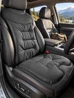 Black ergonomic car seat cushion installed in a road-trip SUV
