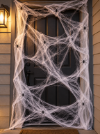 White Halloween spider web with nine black spiders across a dark entry door