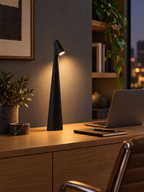 Black rechargeable LED table lamp in a modern home office