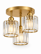 Gold three-light crystal semi flush mount on white background