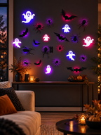 Glowing Halloween ghost bat and spider wall decorations in a modern living room