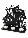 Black haunted house metal tealight holder on a white background