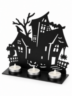 Black haunted house metal tealight holder on a white background
