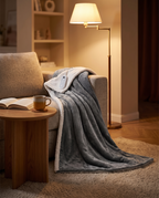 Electric heated blanket in use in a cozy living room, evening