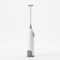 Ergonomic Electric Milk Frother - white background studio product shot