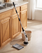 Electric spin scrubber resting in a kitchen, afternoon
