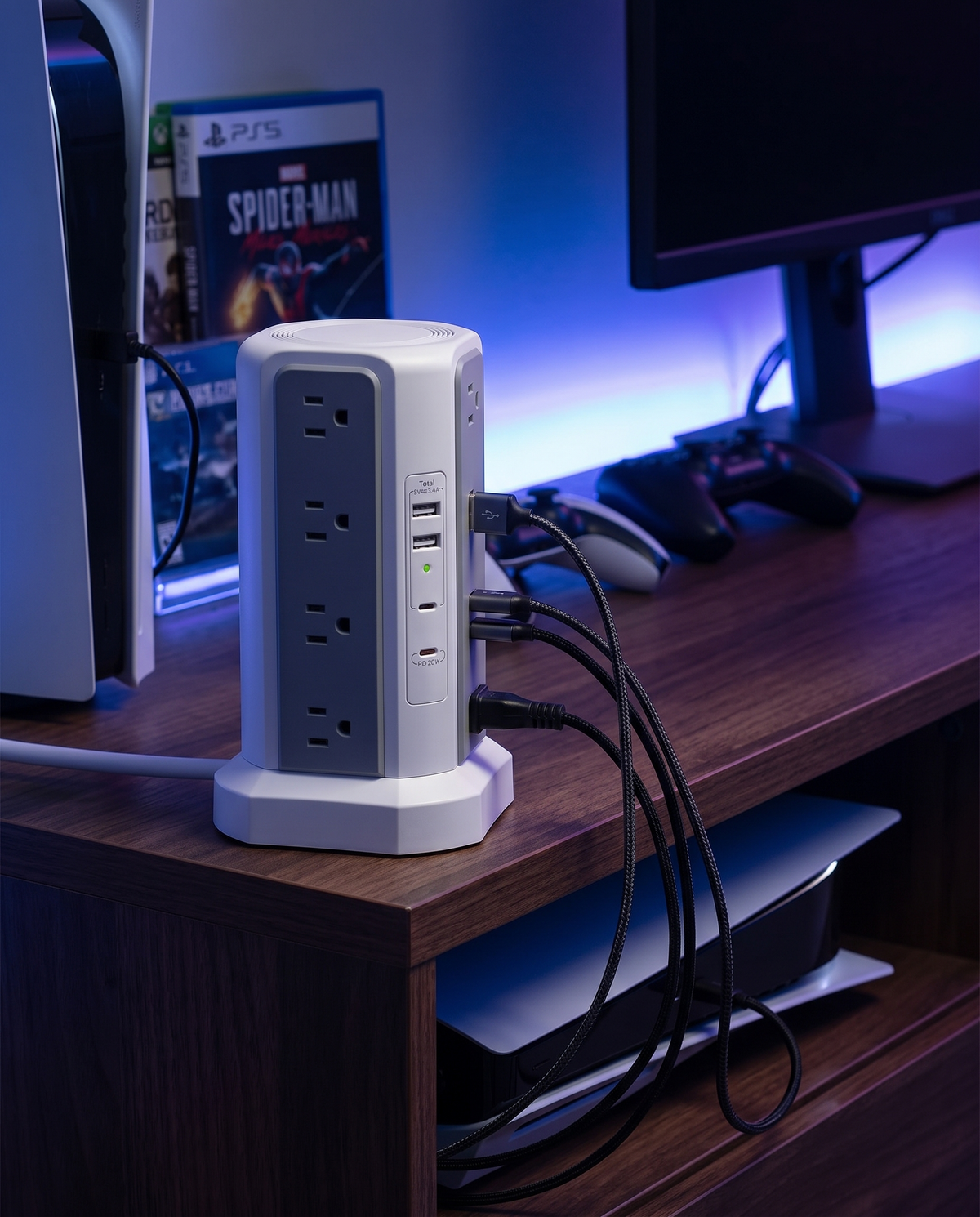USB surge protector power strip behind a gaming console shelf, evening
