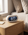 Digital Compact Alarm Clock on a travel hotel-room nightstand