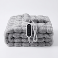 Understated Electric Heated Blanket draped over an armchair in a cabin reading nook