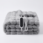 Understated Electric Heated Blanket draped over an armchair in a cabin reading nook
