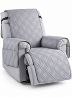 Light gray quilted waterproof recliner cover with side pockets on a white background
