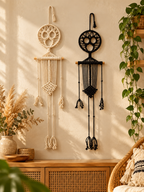 Black and ivory macrame skeleton wall hangings in a boho living room
