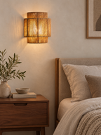 RattanGlow woven wall sconce beside a Japandi bed