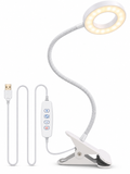 White flexible clamp-on LED desk lamp on white background