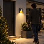LuminiPath motion sensor wall light automatically illuminating a garage entrance