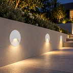 Round recessed outdoor step lights providing low-glare pathway illumination