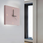 Backlit LED Silent Wall Clock mounted on a bedroom wall with warm backlight