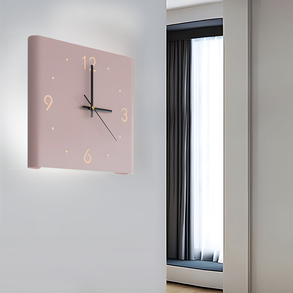 Backlit LED Silent Wall Clock mounted on a bedroom wall with warm backlight
