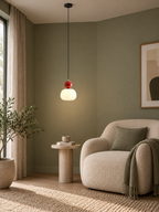 Nordic pumpkin pendant with visible ceiling mount in a reading corner