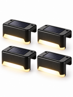 Four-pack solar patio railing lights on white background
