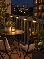 Four solar patio lights on an apartment balcony