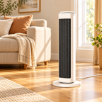 White 25-inch ceramic tower space heater in a sunlit living room