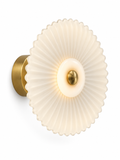Pleated glass wall sconce on white background