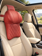 Red leather neck pillow installed in a beige SUV interior