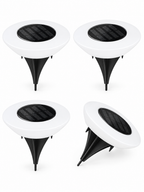 Four-pack of solar ground lights on white background