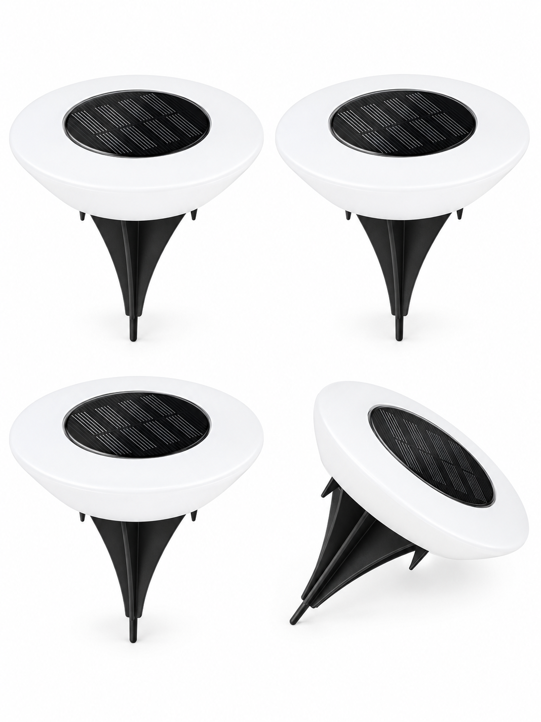 Four-pack of solar ground lights on white background