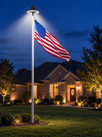 Solar LED flagpole light illuminating an American flag on a suburban lawn