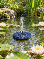Solar water fountain pump spraying in a garden pond with water lilies