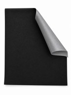 Black static cling blackout window shade with gray reverse on a seamless white background