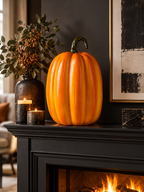 Tall glossy orange pumpkin figure on a dark fireplace mantel