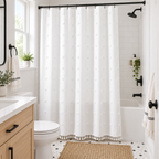 Textured fabric shower curtain in a compact modern bathroom