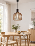 Handcrafted wooden pendant light above a Scandinavian dining table