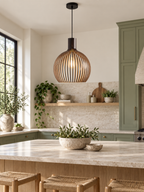 Handcrafted wooden pendant light above an organic modern kitchen island
