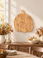 Natural woven pumpkin wall art in a farmhouse dining room