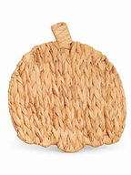 Natural woven pumpkin wall art on a white background